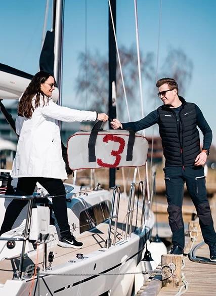 Massive eco-friendly sail cloth bag made from repurposed sails, boasting robust handles, reinforced seams, an expansive interior, and several compartments. Ideal for transporting groceries, beach equipment, travel gear, or oversized items, this durable and fashionable bag offers both sustainability and versatility for various uses