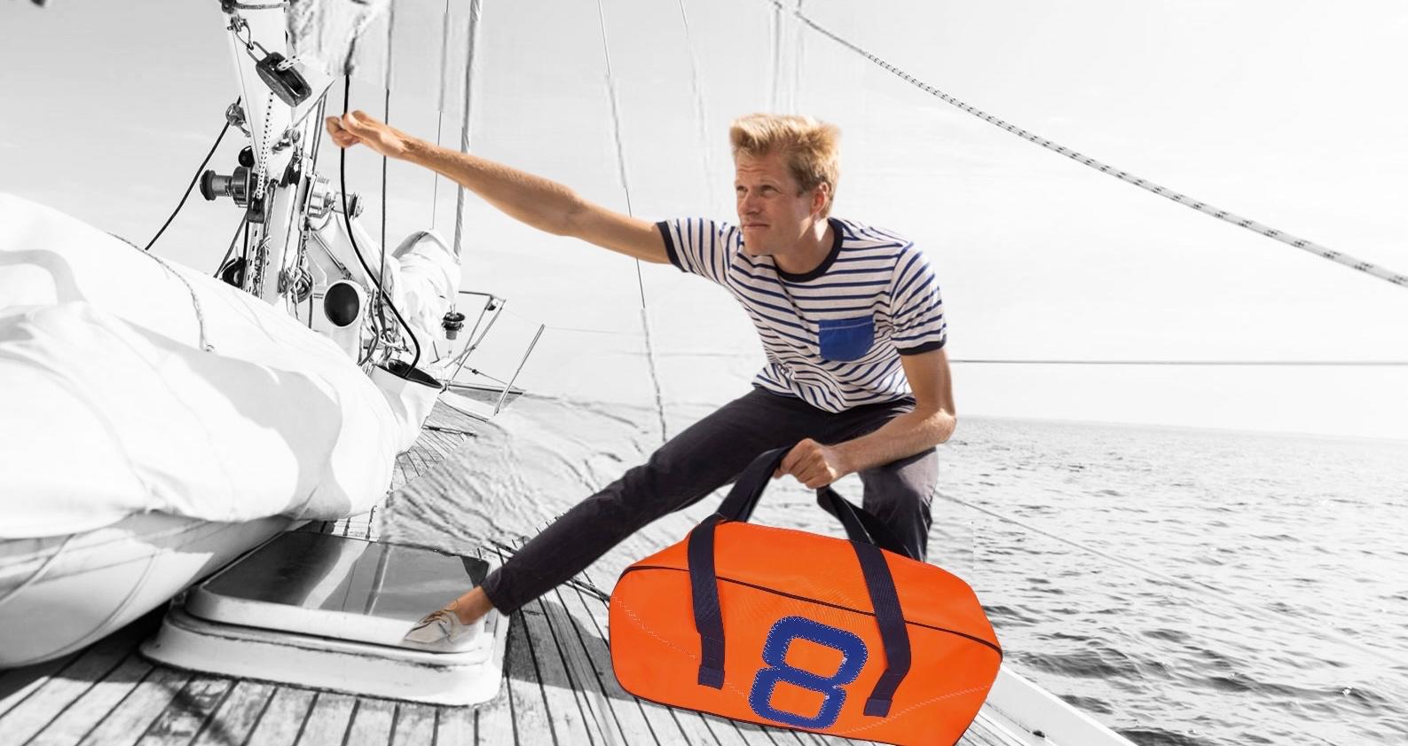 Extra-large eco-friendly sail cloth bag crafted from recycled sails, featuring heavy-duty handles, reinforced stitching, a spacious and deep interior, and multiple pockets, perfect for carrying groceries, beach gear, travel essentials, or bulky items. This durable and stylish bag combines sustainability with practicality, making it ideal for everyday use and outdoor adventures.